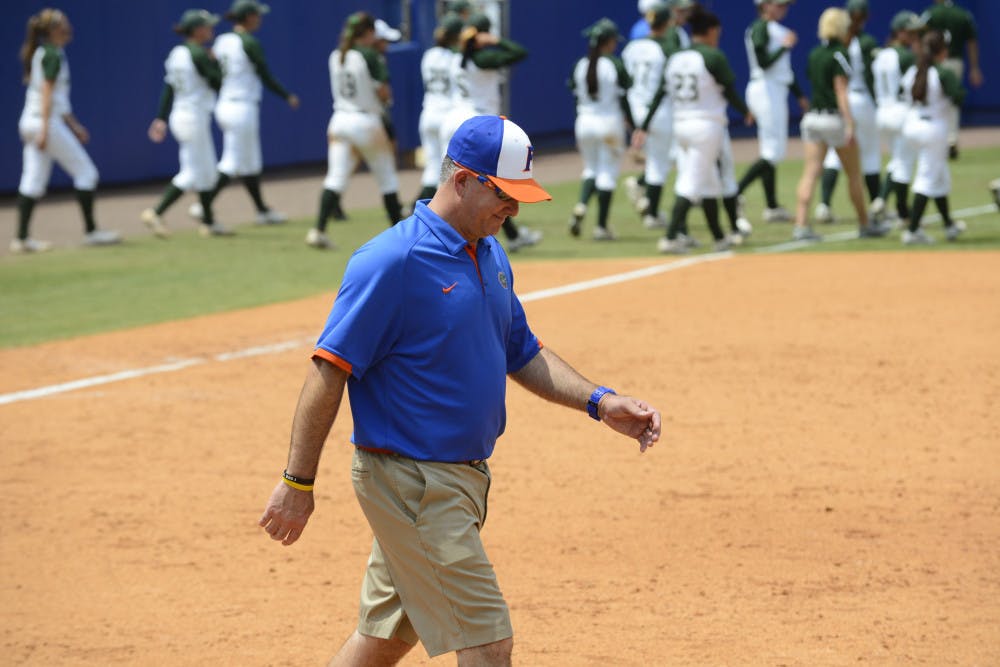 Tim Walton walks off the field after Florida's 2-0 win against USF on May 19 at Katie Seashole Pressly Stadium. Against Tennessee on Thursday, Florida allowed nine runs - its most to an opponent this year. 