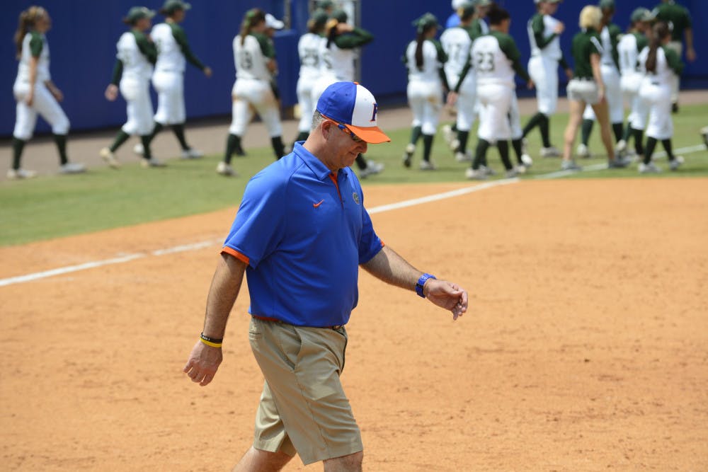 <p>Tim Walton walks off the field after Florida's 2-0 win against USF on May 19 at Katie Seashole Pressly Stadium. Against Tennessee on Thursday, Florida allowed nine runs - its most to an opponent this year. </p>