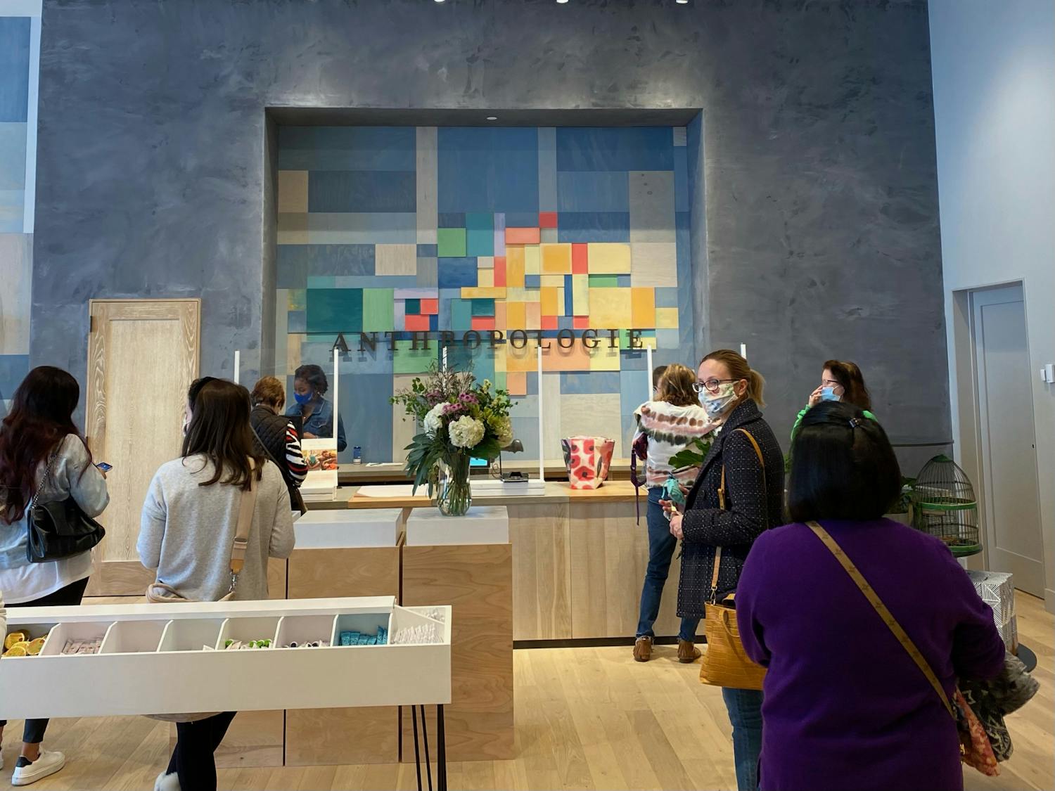 Masked customers shop at the new Gainesville store Wednesday.