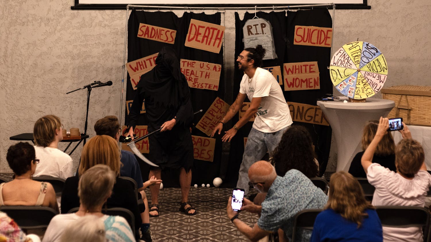 Comedian Ben Wasserman dances with a grimly veiled John Freeman in the show’s closing moments on Sunday, Sept. 17, 2023 at Cypress &amp; Grove Brewing Co.