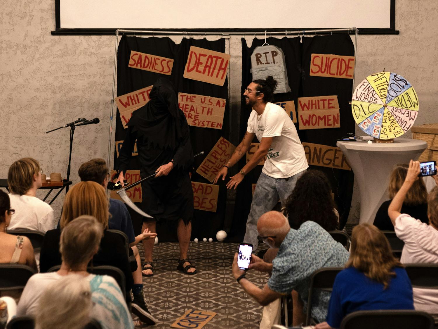 Comedian Ben Wasserman dances with a grimly veiled John Freeman in the show’s closing moments on Sunday, Sept. 17, 2023 at Cypress & Grove Brewing Co.