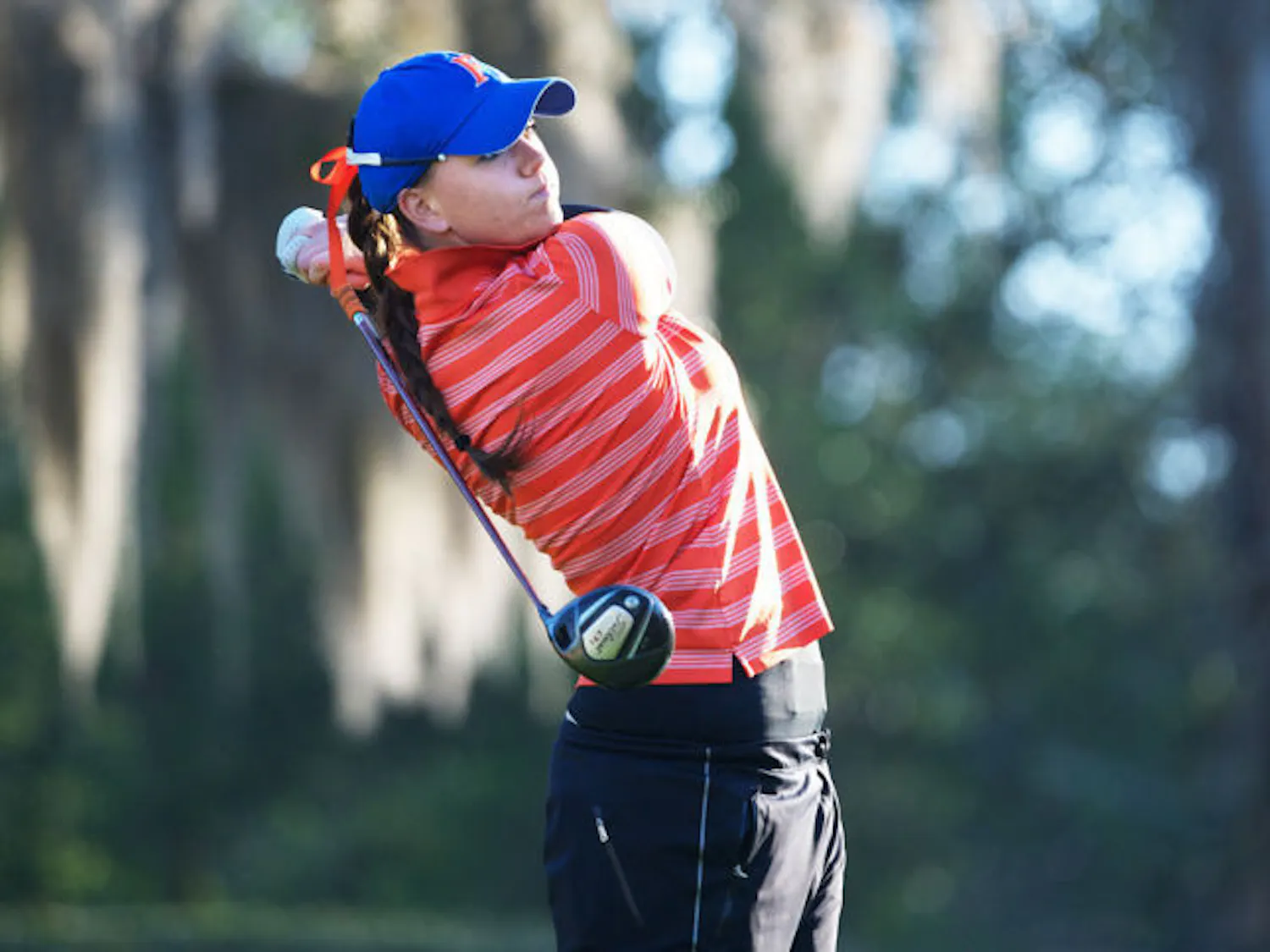 Junior Camilla Hedberg watches her shot during the SunTrust Gator Invitational on March 15 at Mark Bostick Golf Course. 