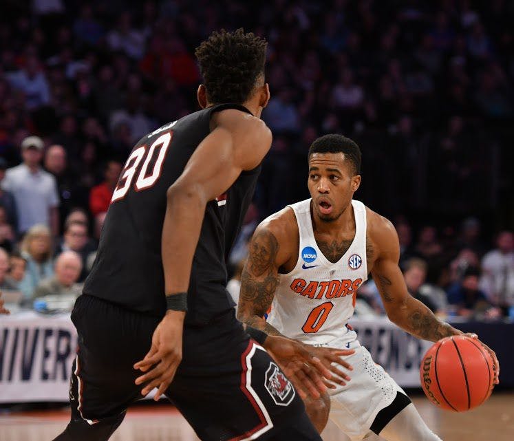 UF guard Kasey Hill dribbles the basketball during Florida's 77-70 loss to South Carolina in the NCAA Tournament on Sunday at Madison Square Garden in New York City.