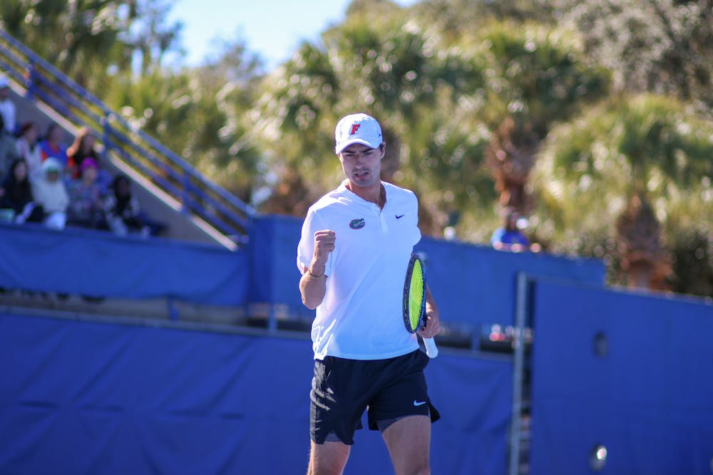Florida graduate student Axel Nefve pumps his fist in the Gators' 5-2 loss to the Texas Longhorns Sunday, Jan. 15, 2023.