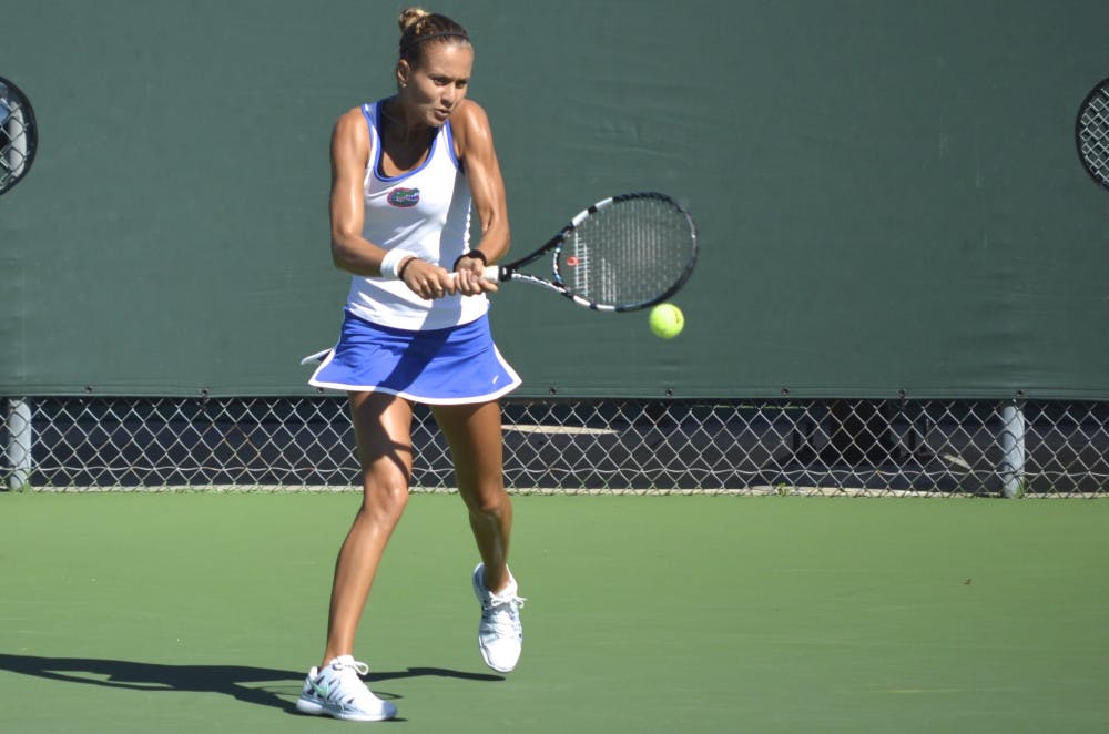 <p>Senior Olivia Janowicz hits the ball during her second-round singles match against FSU freshman Eduarda Dos Santos at the Bedford Cup on Friday at the Ring Tennis Complex. Janowicz won the match in two sets 7-5, 6-1.</p>