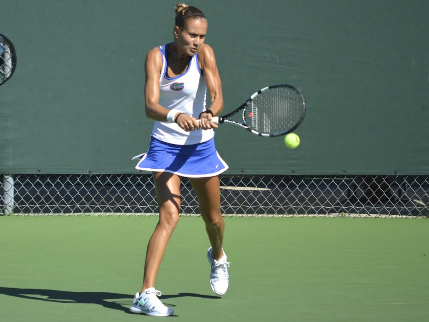 Senior Olivia Janowicz hits the ball during her second-round singles match against FSU freshman Eduarda Dos Santos at the Bedford Cup on Friday at the Ring Tennis Complex. Janowicz won the match in two sets 7-5, 6-1.