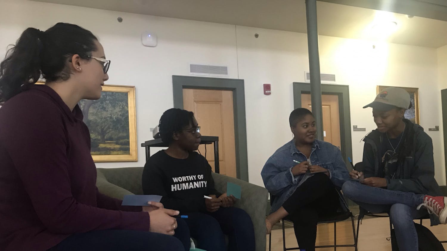 Students group up to share their experiences facing discrimination and oppression in both their personal lives and the education system. From left to right: Nesreen Ghnaim, 21, psychology senior; Venice Saintilus, 19, psychology sophomore; Anneleila Joachim, 20, African American studies junior and Camya Robinson, 20, wildlife ecology and conservation junior.