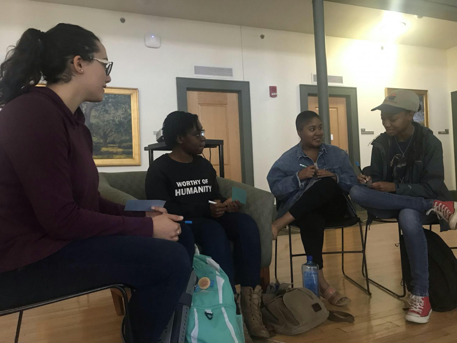Students group up to share their experiences facing discrimination and oppression in both their personal lives and the education system. From left to right: Nesreen Ghnaim, 21, psychology senior; Venice Saintilus, 19, psychology sophomore; Anneleila Joachim, 20, African American studies junior and Camya Robinson, 20, wildlife ecology and conservation junior.     