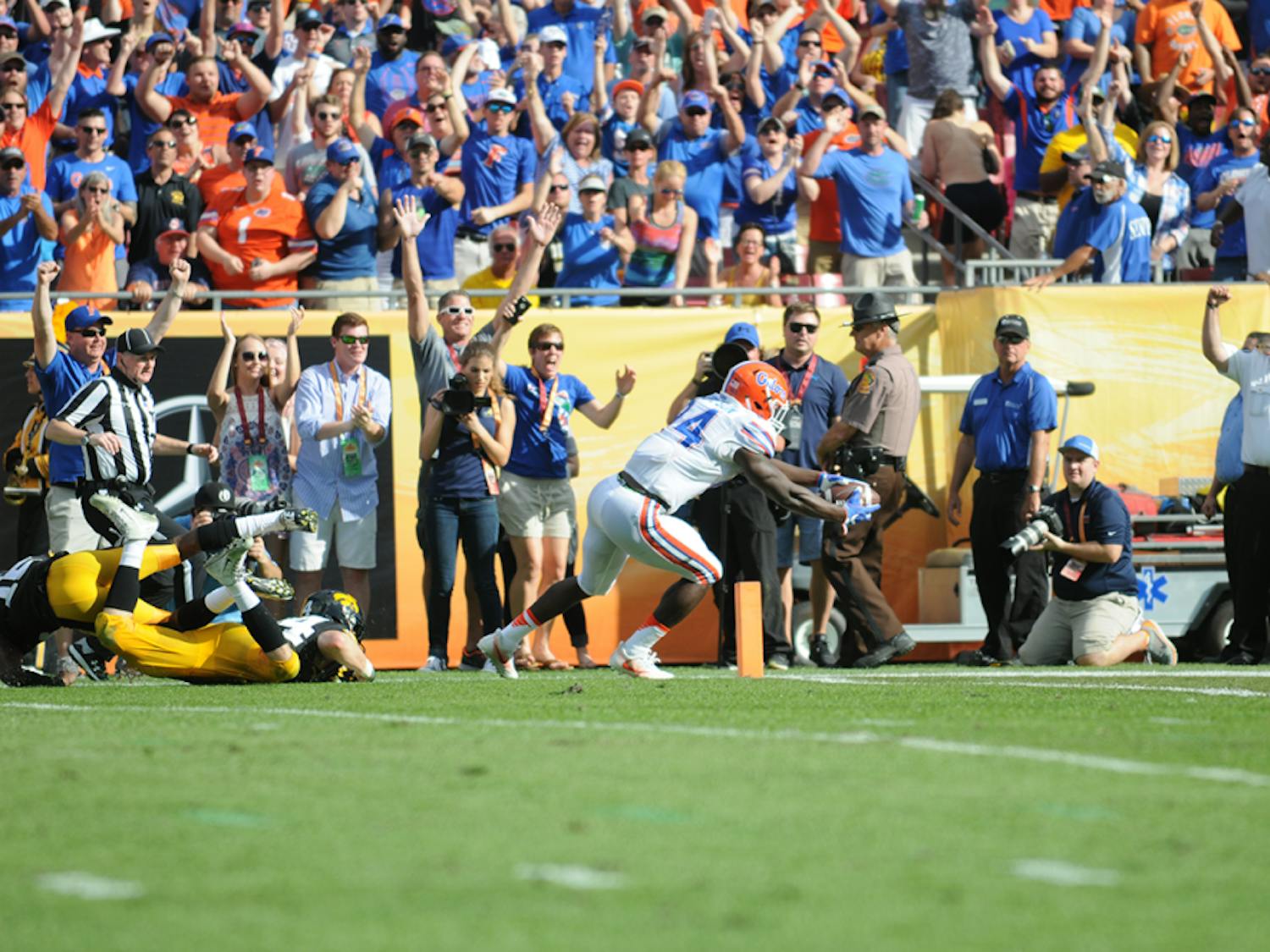 Mark Thompson dives for the end zone to cap an 85-yard touchdown catch during Florida's 30-3 win over Iowa in the Outback Bowl.