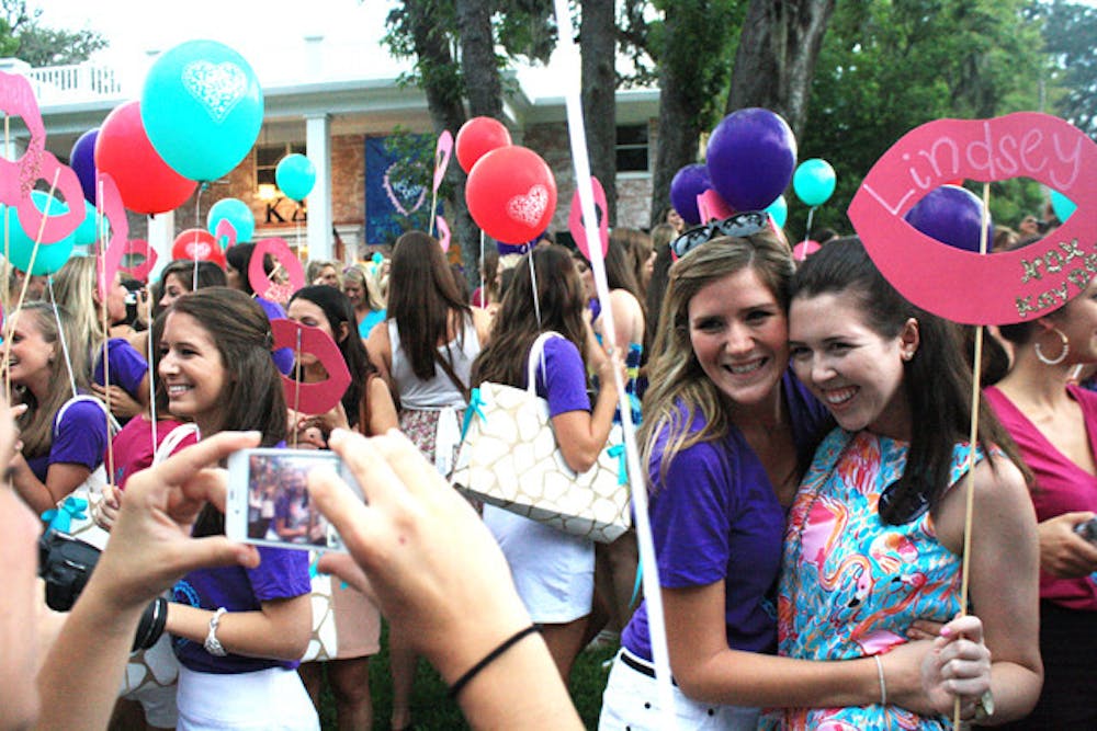 <p>Kappa Delta pledges meet their new sisters in front of their sorority house on Tuesday evening. About 1,500 women joined the 2011 pledge class for the 16 chapters of sororities on the UF campus.</p>