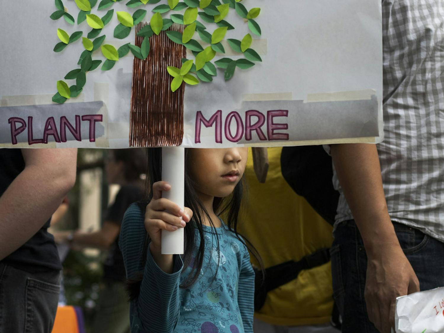 Mika Lee, 6, holds participates in the climate protest Sept. 20 at City Hall.