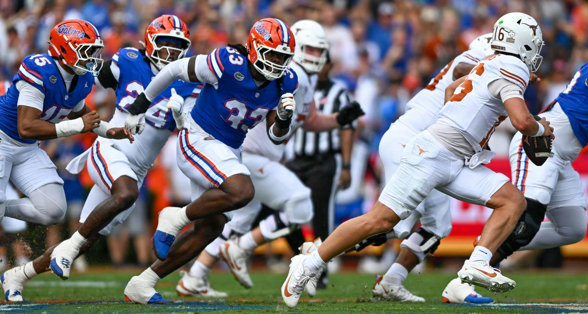 Florida Gators defensive lineman Brien Taylor Jr. (33) runs after Texas Longhorns quarterback Arch Manning (16) during a football game between the Texas Longhorns and the Florida Gators on Saturday, Oct. 4, 2025, at Ben Hill Griffin Stadium in Gainesville, Fla.