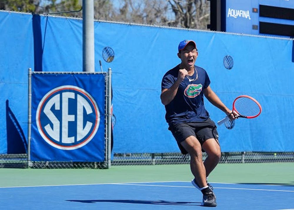 <p>Jeremy Jin celebrates after winning a point for UF during a match against UCF on Feb. 19. at Linder Stadium. </p>