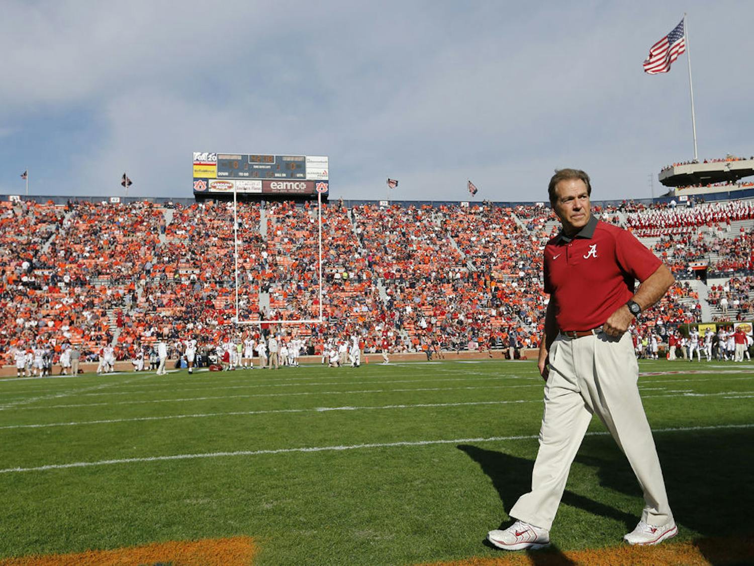 Alabama head coach Nick Saban walks across the football field before an NCAA college football game against Auburn on Saturday in Auburn, Alabama.