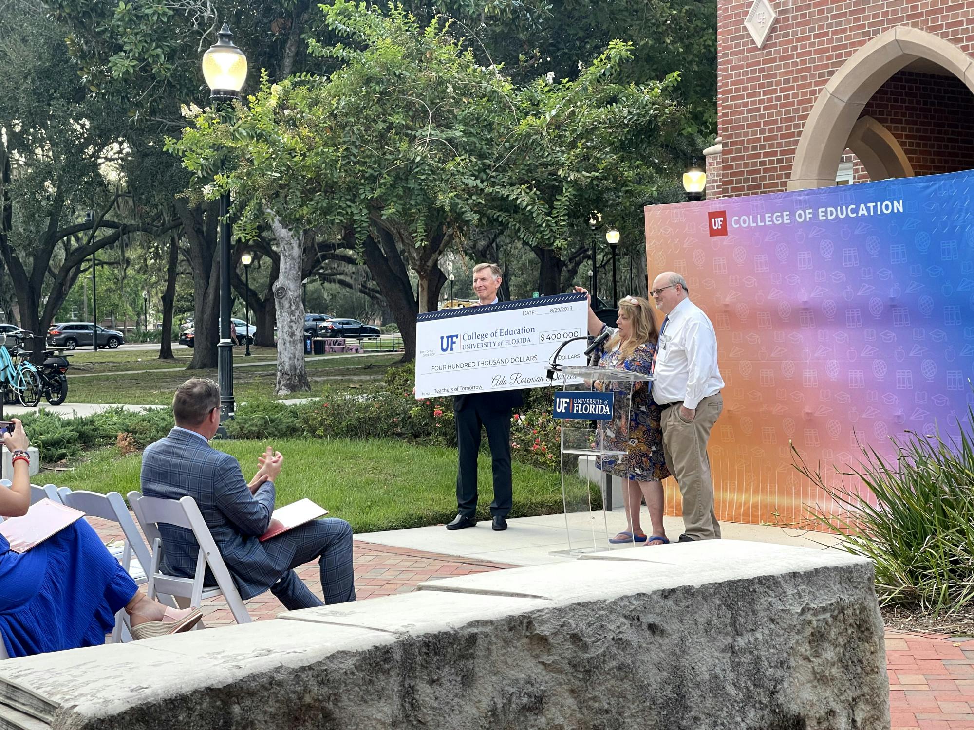 Attendees watch the naming of Ada Rosenson Dorfeld Plaza outside of the Norman Hall College of Education on Thursday, Sept. 14, 2023. 