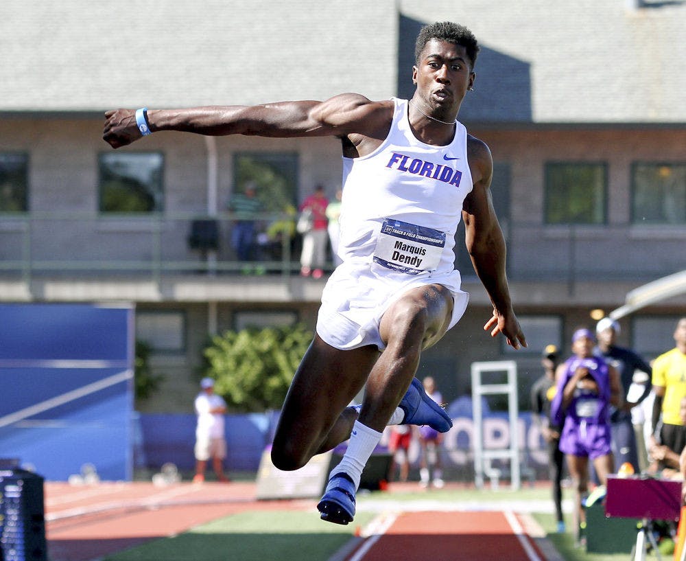 <p>Florida's Marquis Dendy leaps on his way to winning the triple jump during the NCAA track and field championships in Eugene, Ore., Friday, June 12, 2015.</p>