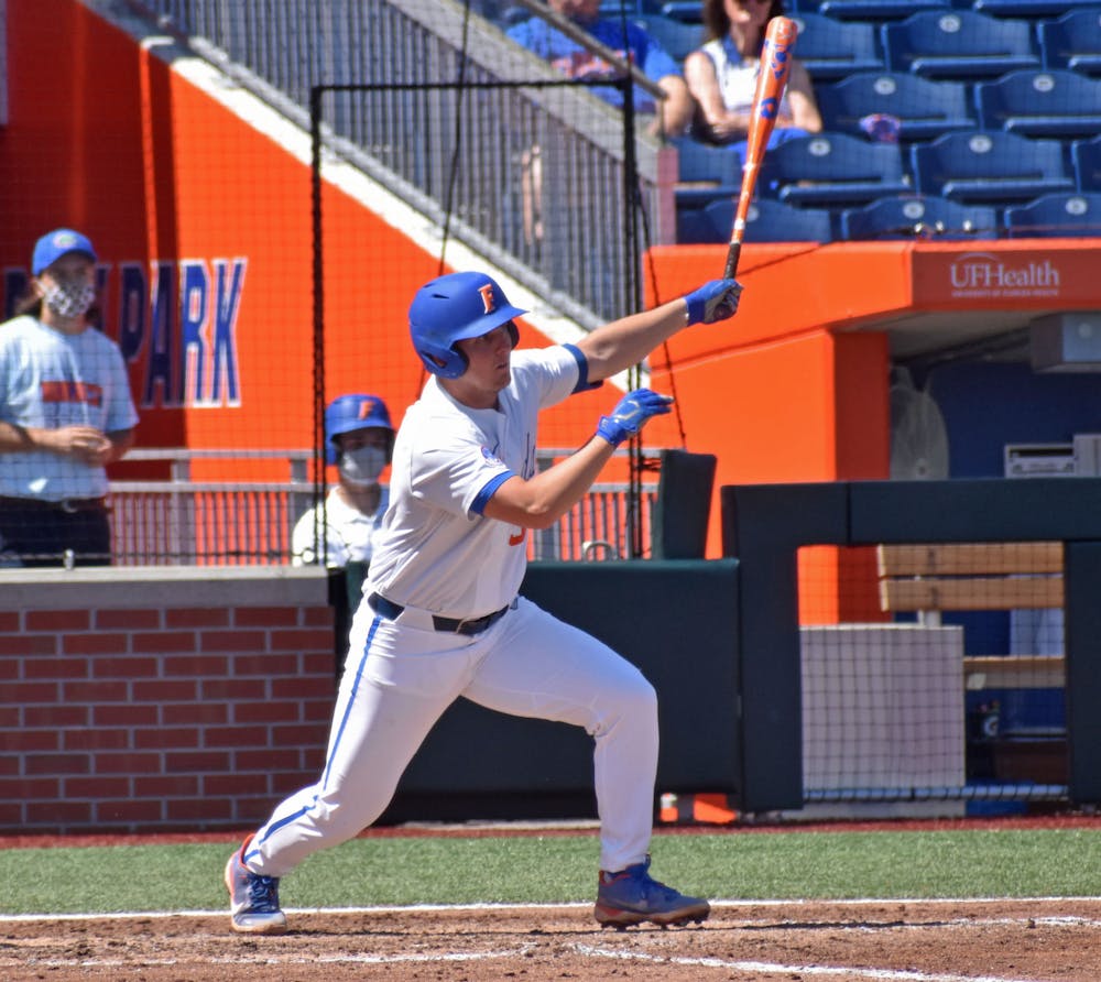 Kirby McMullen finishes a swing and begins to run to first base against Jacksonville on March 14. McMullen rides a seven-game hit streak into this weekend's series against Vanderbilt.