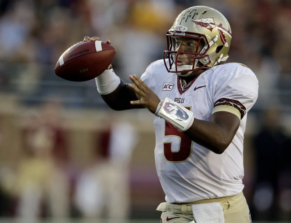 Florida State quarterback Jameis Winston (5) throws a pass during the second half of FSU's 48-34 win at Boston College on Sept. 28.