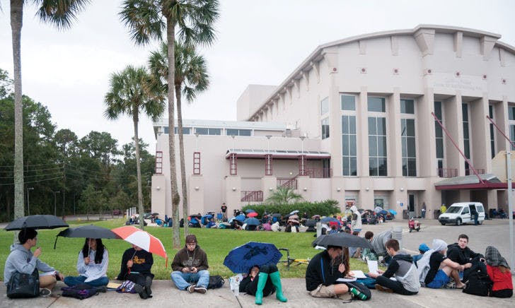 People brave the rain Wednesday morning and wait in line around the Phillips Center for the Performing Arts to get tickets for Bill Nye’s event tonight, hosted by the Accent Speaker’s Bureau.