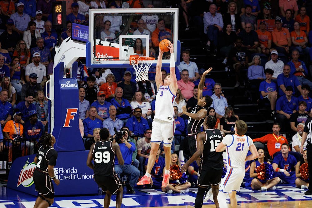 <p>Florida Gators center Micah Handlogten (3) catches an alley-oop during the first half of an NCAA college basketball game against Mississippi State, Tuesday, March 3, 2026, in Gainesville, Fla.</p>