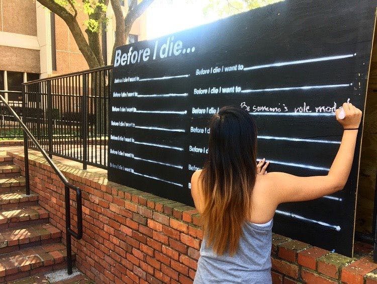 UF Health installed 12 “Before I Die” walls in downtown Gainesville, around UF Health buildings and on campus for the second year in a row. The walls raise awareness for advance directives, which are written statements of a person’s preferred medical treatment if they are too ill or incapacitated to communicate with a doctor.
&nbsp;