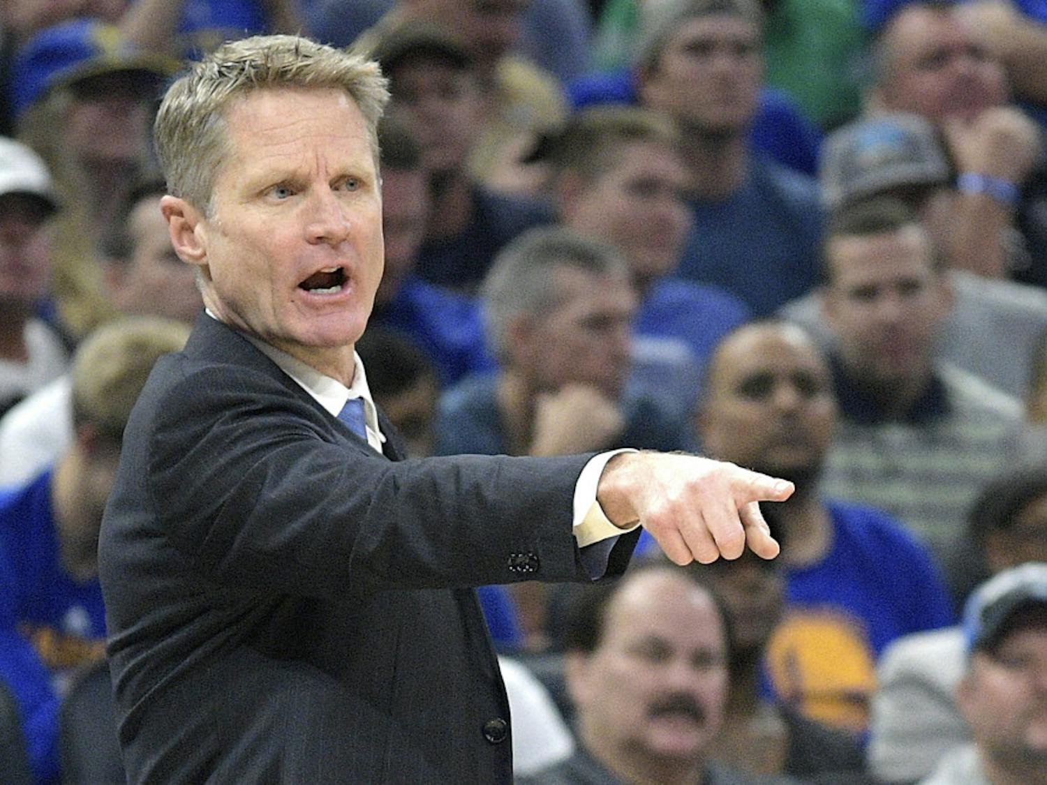 Golden State Warriors head coach Steve Kerr calls out instructions during the first half of an NBA basketball game against the Orlando Magic in Orlando, Fla., Sunday, Jan. 22, 2017. (AP Photo/Phelan M. Ebenhack)