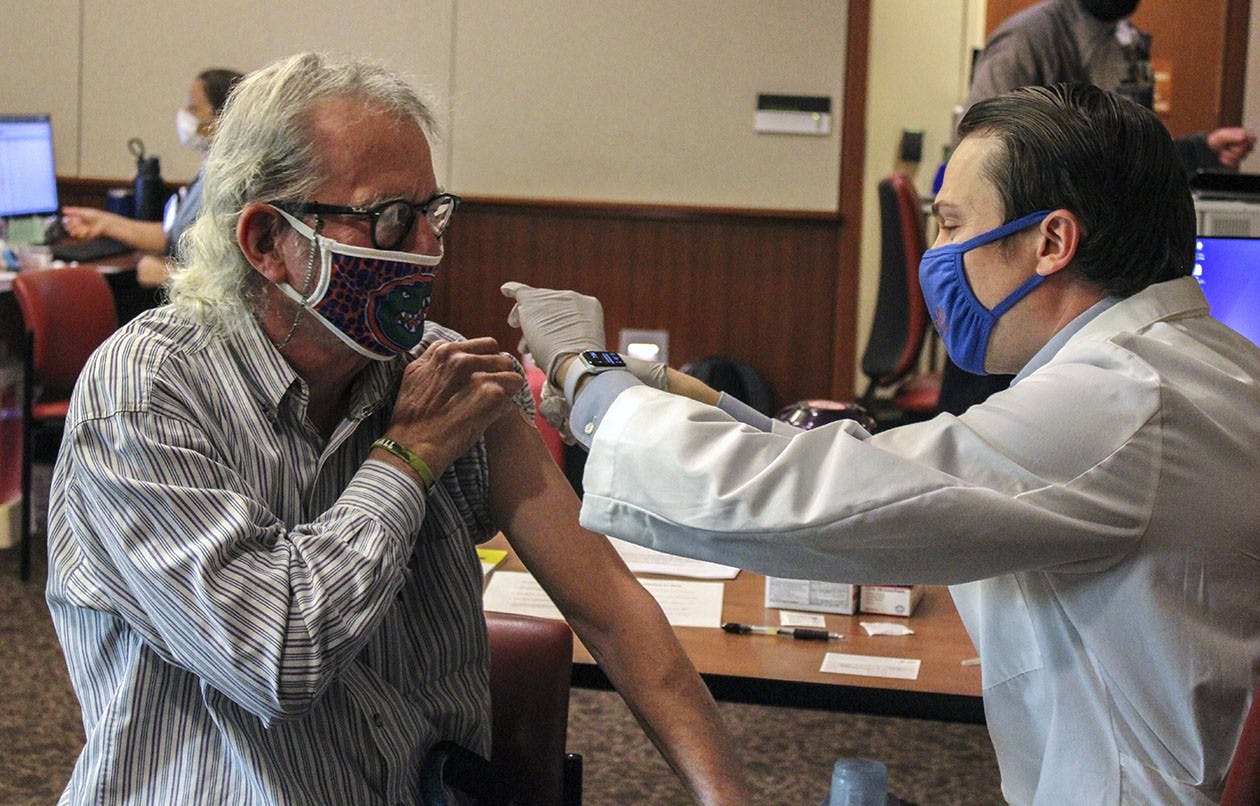 Mike Foley, UF journalism professor, receives his first dose of the Pfizer-BioNTech COVID-19 vaccine on Jan. 5, 2021.