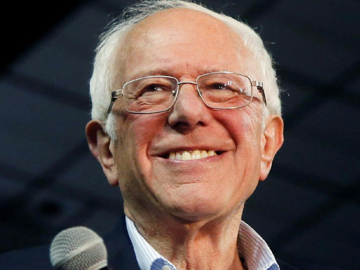 Democratic presidential candidate Sen. Bernie Sanders, I-Vt., smiles as he walks on stage to applause at a campaign rally Thursday, March 5, 2020, in Phoenix. (AP Photo/Ross D. Franklin)