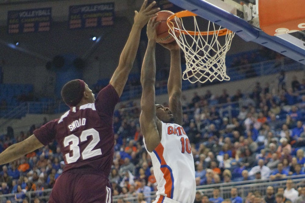 <p>Dorian Finney-Smith dunks during Florida's 81-78 win against Mississippi State on Tuesday in the O'Connell Center.</p>