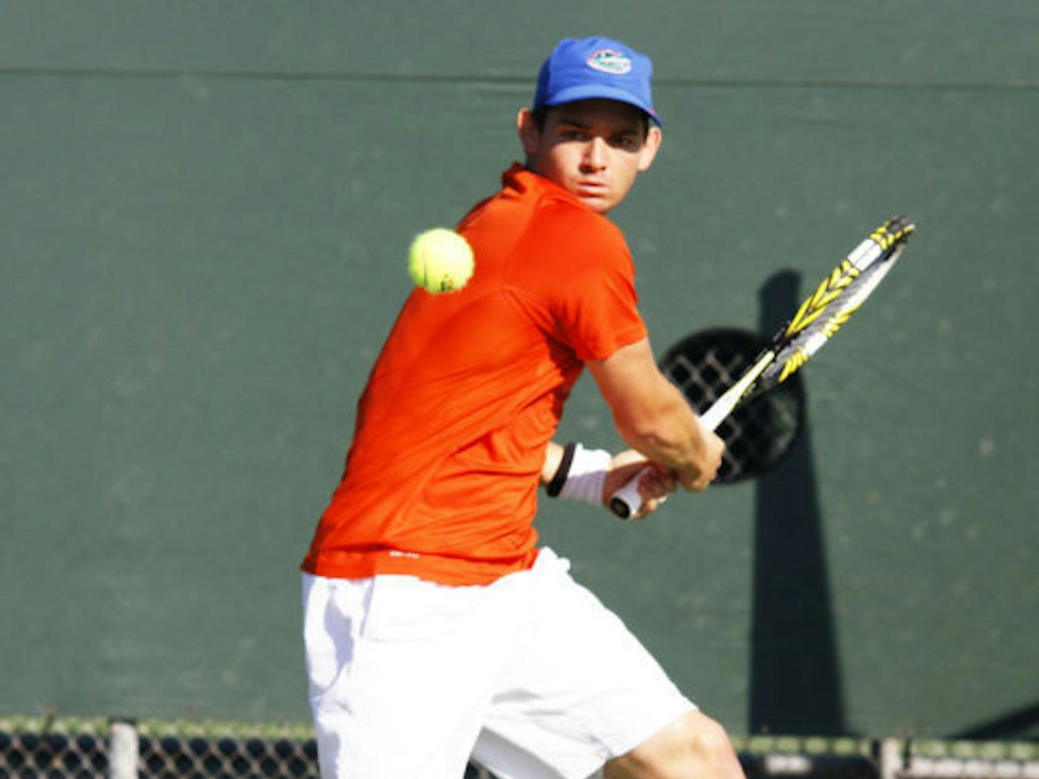 Senior Billy Federhofer prepares to backhand the ball during Florida’s 7-0 win against St. John’s on Jan. 26 at Linder Stadium. Federhofer dropped his last set 1-6 to end the Gators' 4-3 loss in the NCAA Tournament on Friday.