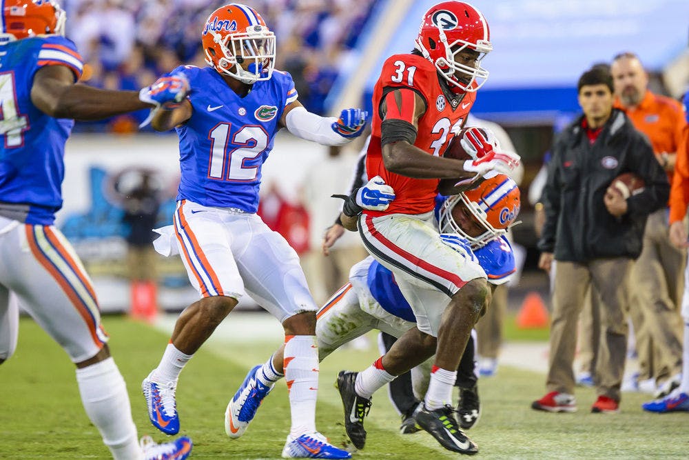 <p>Antonio Morrison attempts a tackle during Florida's 38-20 win against Georgia on Nov. 1, 2014.</p>