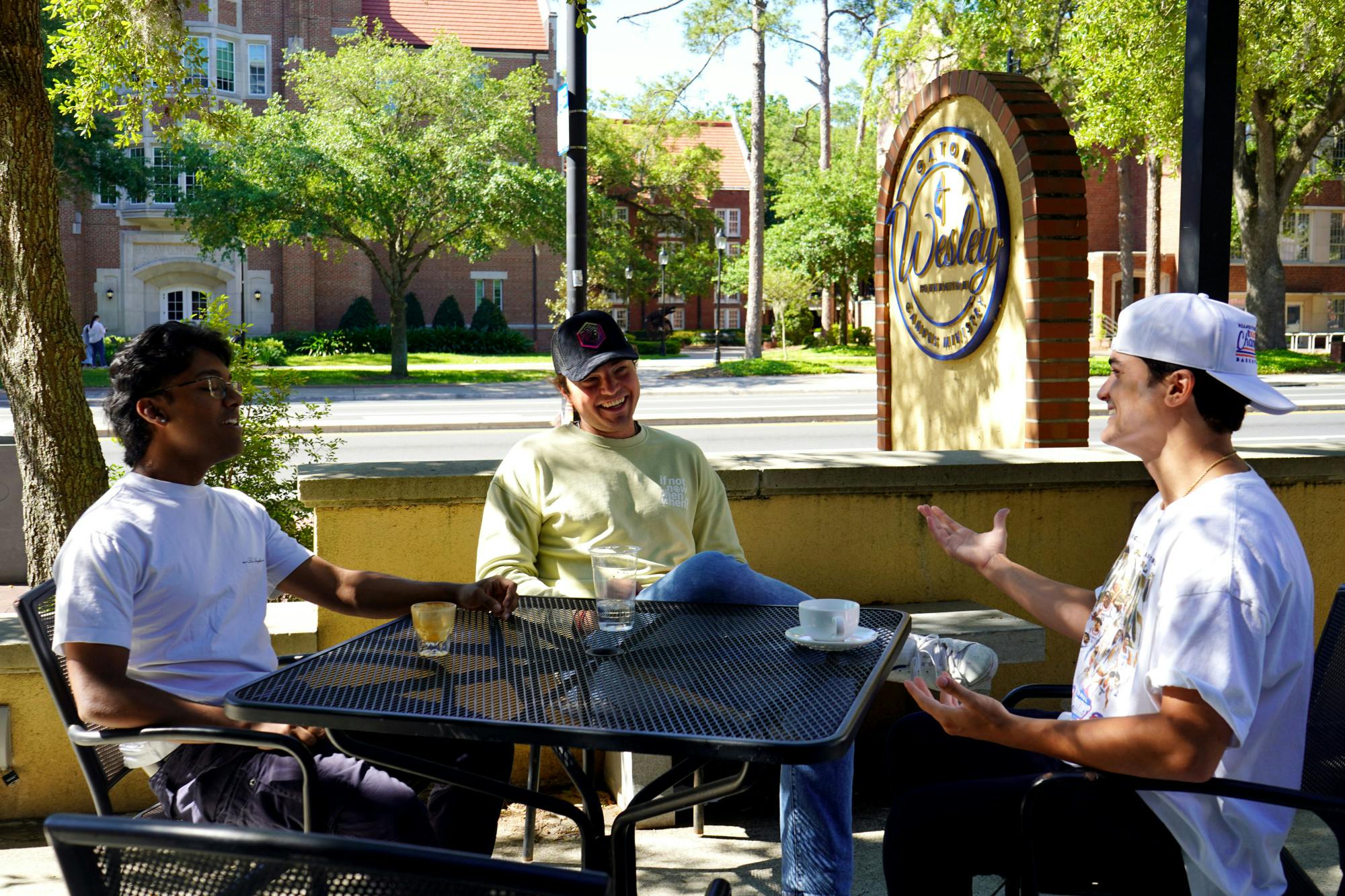 The founders of the Siren app sit for a business meeting outside Concord Coffee on Sunday, April 13, 2025.
