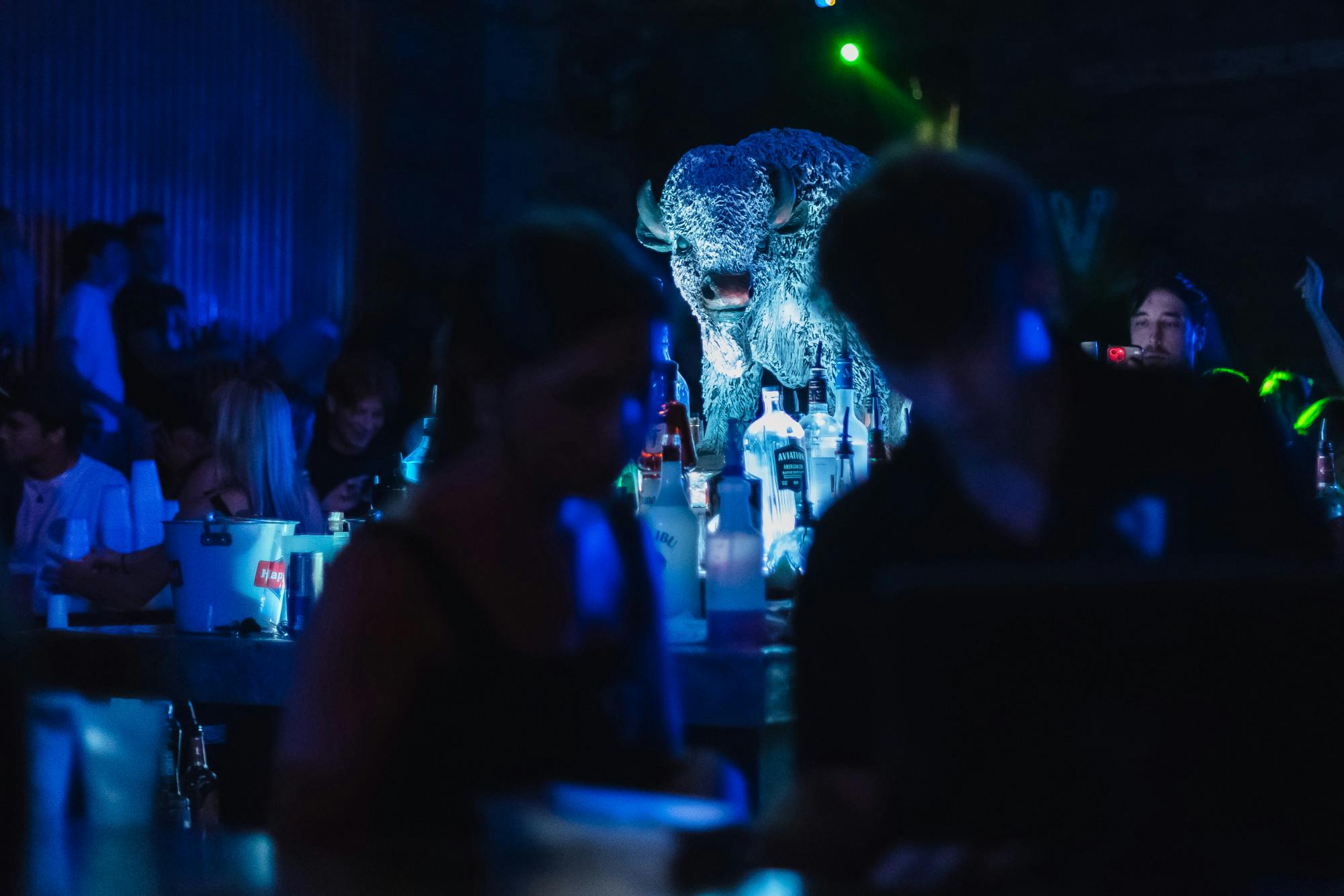 Bartenders tend to drinks for the Hurricane Party at White Buffalo on Saturday, Sept. 28, 2024.