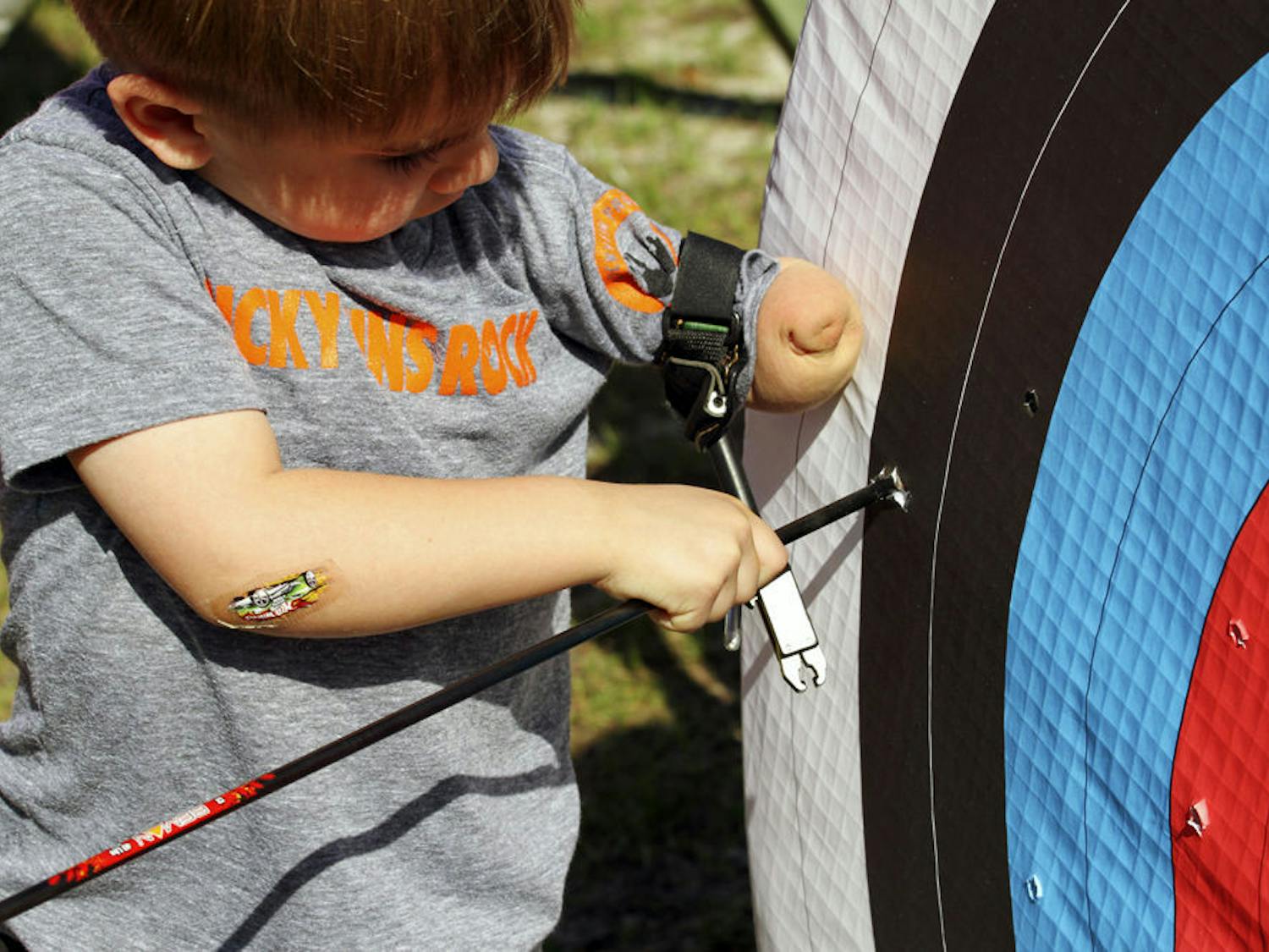 Above is a participant in Hand Camp. Children in the camp can take part in activities like archery or climbing. The camp’s motto is, “differences do not equal disability.”
