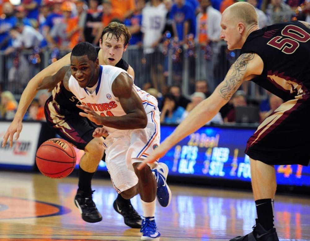 <p>Florida and point guard Erving Walker (center) will be facing its toughest defense test of the season in Friday’s NCAA Tournament game against No. 10 Virginia, which limits opponents to just 53.7 points per game.</p>