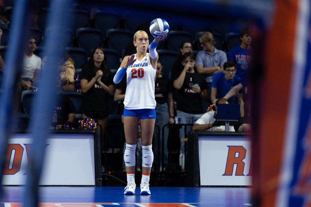 Florida Gators setter Taylor Parks (20) prepares to serve the ball during a volleyball match against the Baylor Bears at Exactech Arena at the Stephen C. O'Connell Center on Sunday, September 14, 2024.