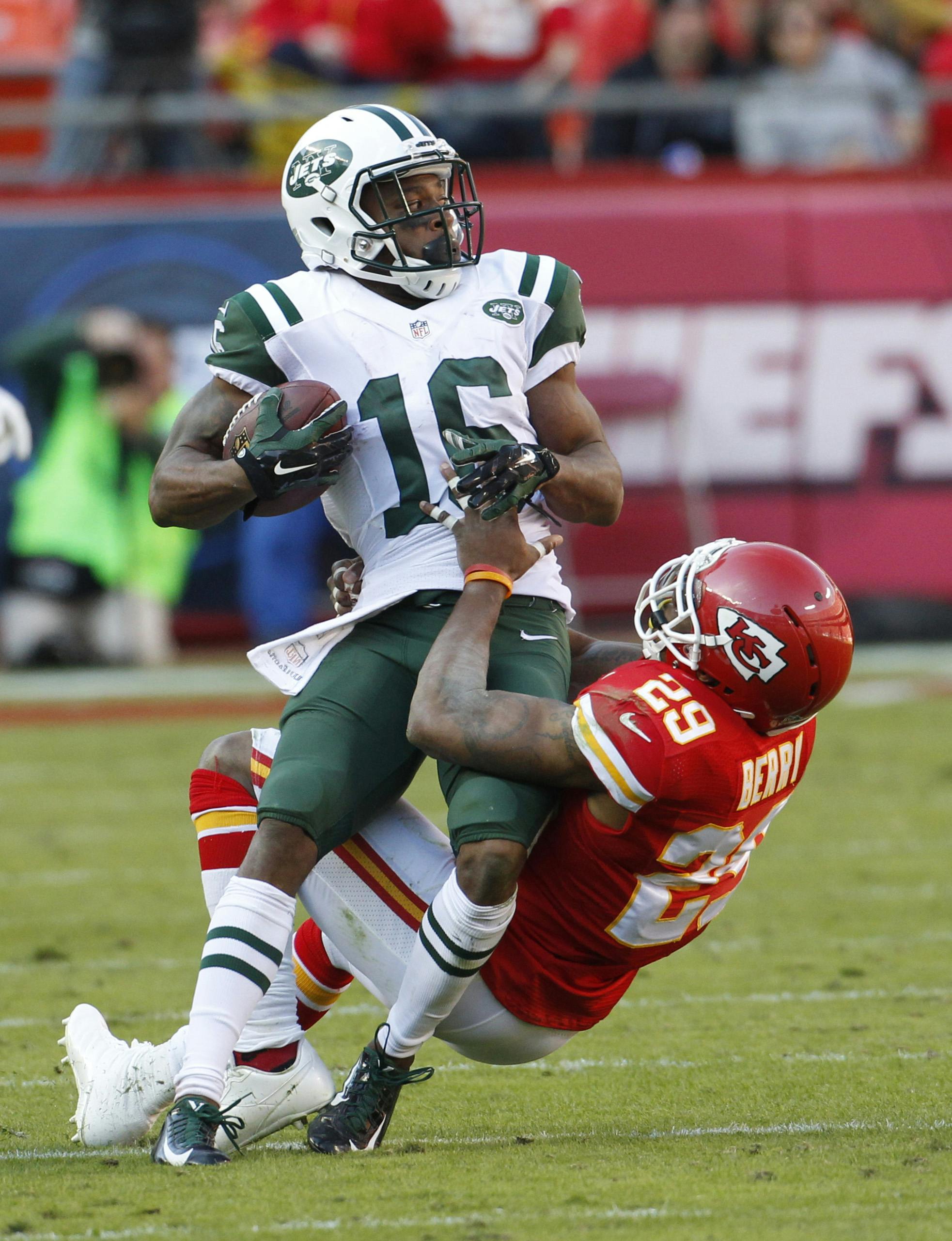 New York Jets wide receiver Percy Harvin (16) is pulled down by Kansas City Chiefs strong safety Eric Berry (29) in the second half of an NFL football game in Kansas City, Mo., Sunday, Nov. 2, 2014.
