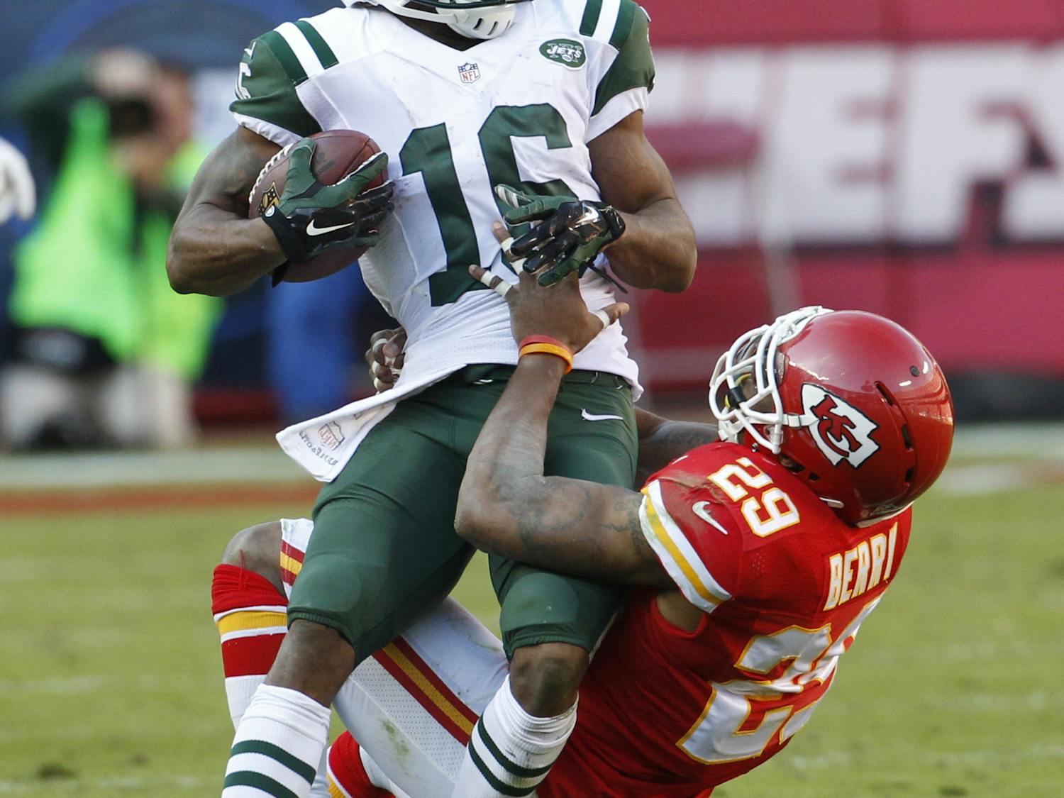 New York Jets wide receiver Percy Harvin (16) is pulled down by Kansas City Chiefs strong safety Eric Berry (29) in the second half of an NFL football game in Kansas City, Mo., Sunday, Nov. 2, 2014.