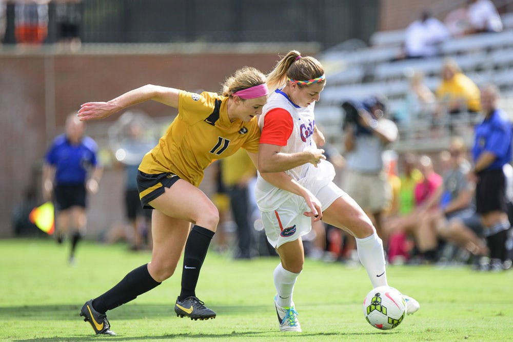 Savannah Jordan (right) fights with Missouri's Lauren Flynn (11) to maintain possession of the ball during Florida's 3-1 win against Missouri on Sunday at Donald R. Dizney Stadium.