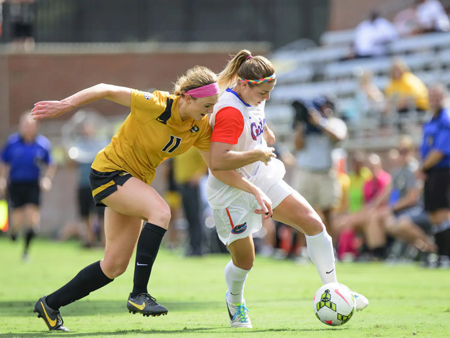 Savannah Jordan (right) fights with Missouri's Lauren Flynn (11) to maintain possession of the ball during Florida's 3-1 win against Missouri on Sunday at Donald R. Dizney Stadium.
