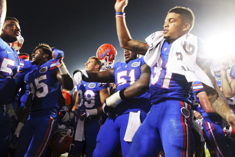 <p>Sophomore defensve back Jalen Tabor (31) dances while the Gator Marching Band plays following Florida's 61-13 win against New Mexico State. The win made a new record for most points scored during a UF head coach's first game.</p>