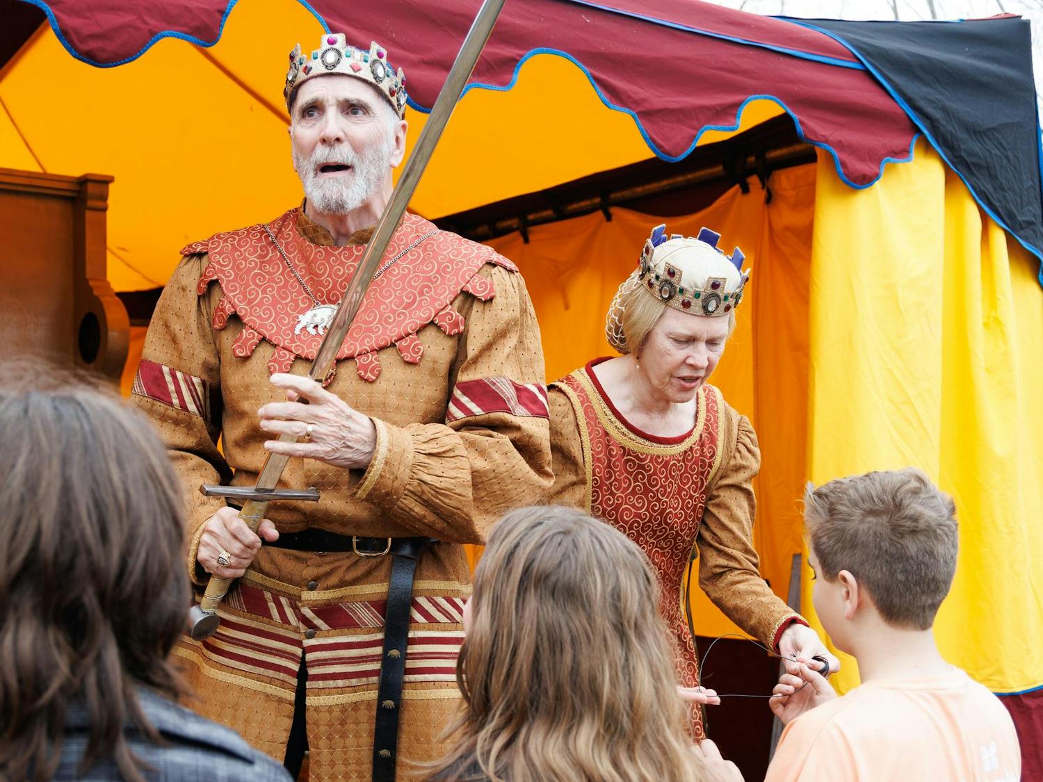 Michael Huey and Fontaine Huey knight attendees of the Hoggetown Medieval Faire at Depot Park, Sunday, Jan. 25, 2026.