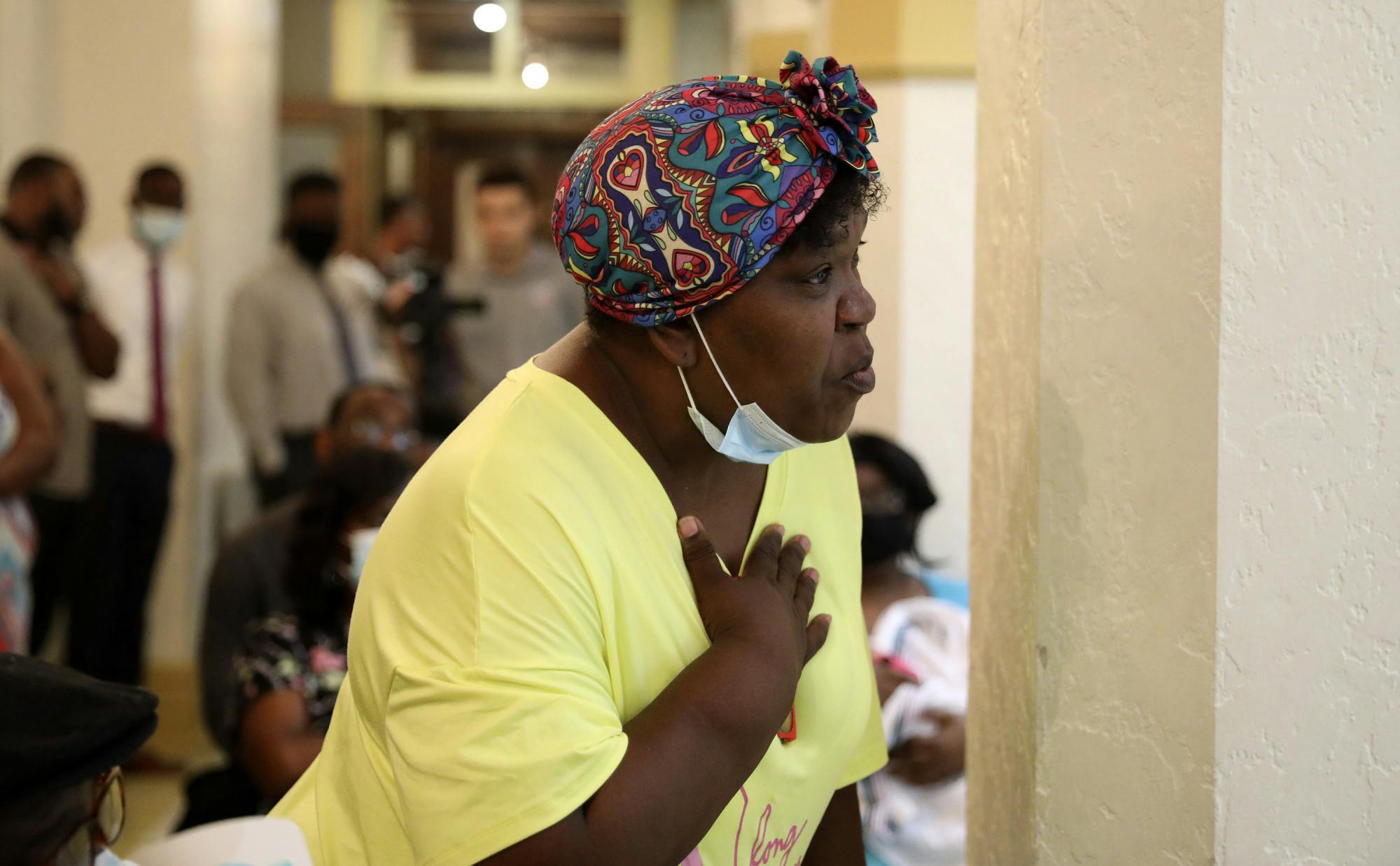 Tracy Barewell-Anderson,  a Gainesville resident, holds her hand on her chest as she talks about her concerns over gun violence during the Community Call-to-Action meeting at the Thomas Center on Thursday, July 1, 2021.