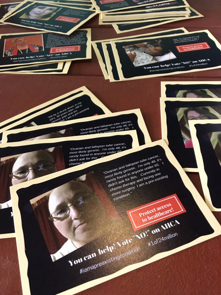 On Friday night, through the use of postcards, 32 women with pre-existing health conditions told their stories to protest the American Health Care Act.