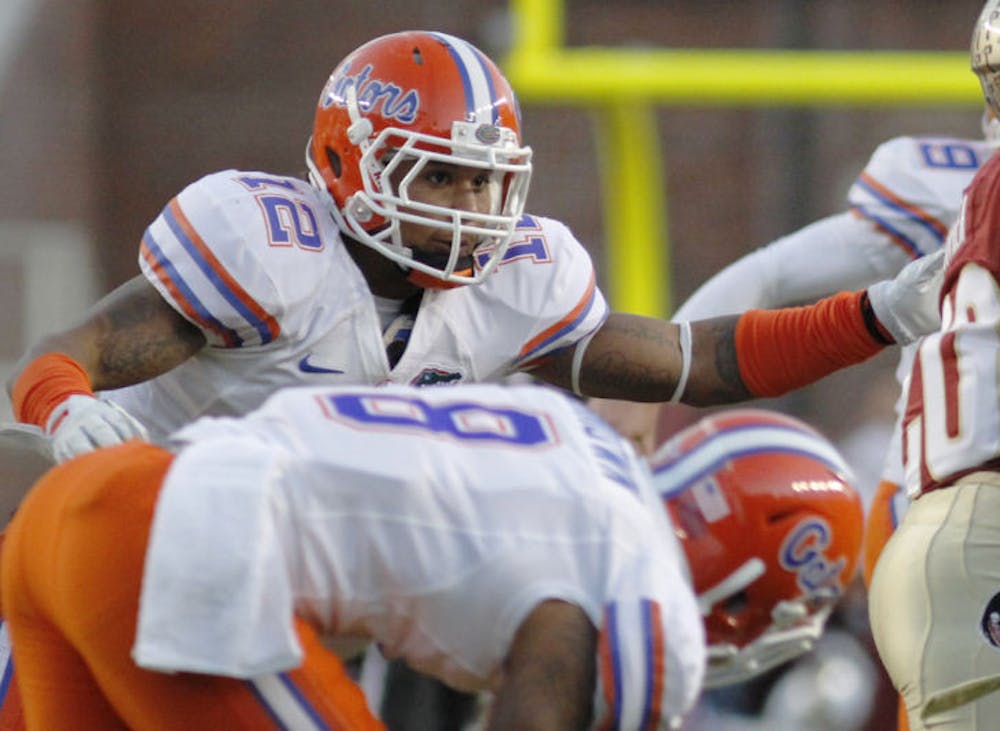 <p>Sophomore linebacker Antonio Morrison reaches for Lamarcus Joyner during Florida’s 37-26 victory against Florida State on Nov. 24 in Doak Campbell Stadium. After sitting out the Gators’ season opener on Aug. 31 due to a suspension stemming from two offseason arrests, Morrison is listed as the backup at the Mike linebacker position for Saturday’s game against Miami.</p>