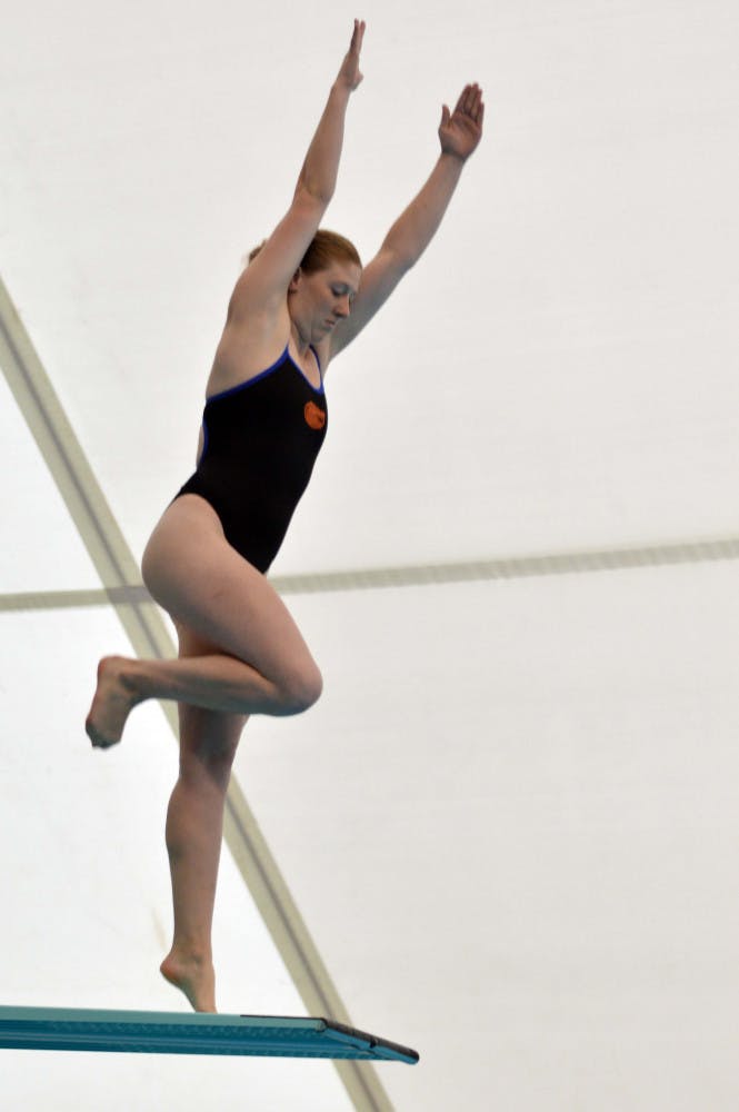 Khalia Warner competes on the three-meter dive during UF's win against Arkansas in the O'Connell Center.