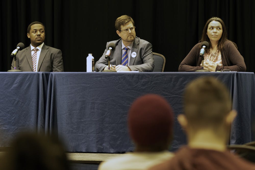 Marlon Bruce (left), incumbent Mayor Lauren Poe (middle) and Jenn Powell (right) answer questions Monday during the Gainesville Mayoral Candidate Debate in the Rion East Ballroom in the J. Wayne Reitz Union. Topics ranged from affordable housing to marijuana, and about 50 people attended the event.