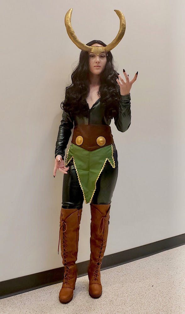 Lady Loki
Kati Ankrom, 21, resident of Leesburg, Florida, attended SwampCon as a genderbent Thor character, Lady Loki. Gender bending is when someone cosplays a character as its opposite gender.
Ankrom has been improving the costume for the past four years. She first cosplayed Lady Loki when she was 18 and felt very proud when she finished the costume in nine months.
Most of the cosplay is made out of a latex bodysuit and is not breathable, according to Ankrom.
“These horns I’ve had for like three years,” she said. “I refuse to get rid of them.”
She advises first-time cosplayers to not make the costume harder than it needs to be.
“You will get better eventually,” she said. “Just start at the beginning and work your way up.”
&nbsp;