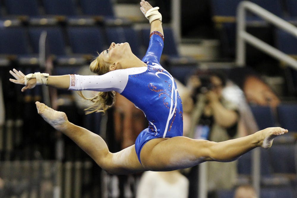 <p>Florida gymnast Randy Stageberg competes in the floor exercise during the semifinals of the NCAA college women's gymnastics championships Friday. Stageberg received a point deduction after stepping out of bounds during floor exercise, resulting in a 9.75 score.</p>