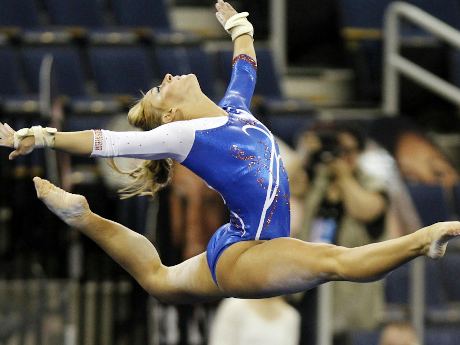 Florida gymnast Randy Stageberg competes in the floor exercise during the semifinals of the NCAA college women's gymnastics championships Friday. Stageberg received a point deduction after stepping out of bounds during floor exercise, resulting in a 9.75 score.